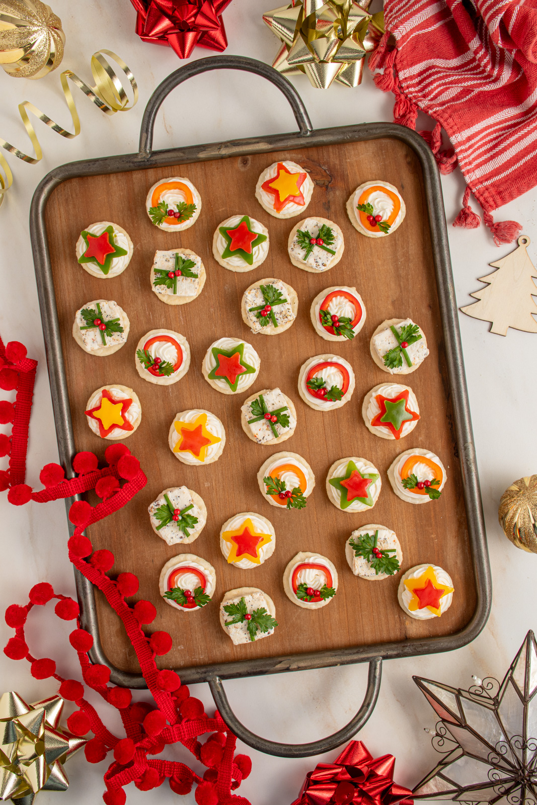 A tray with christmas appetizers.