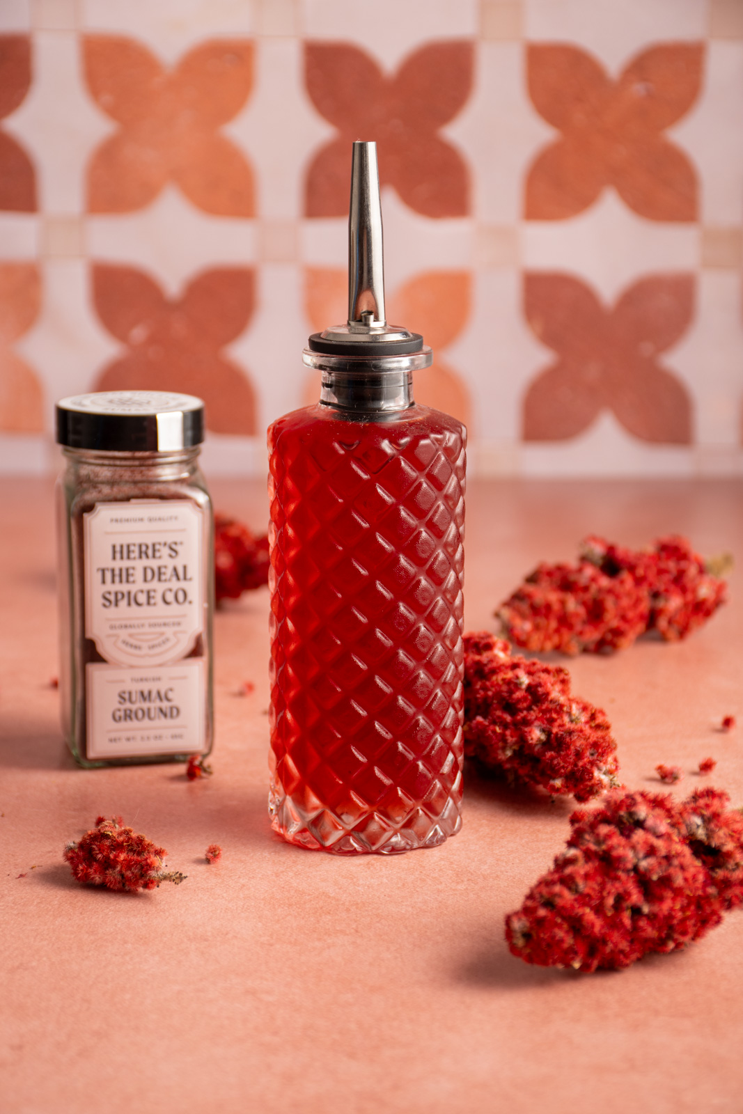 A small bottle with sumac simple syrup.